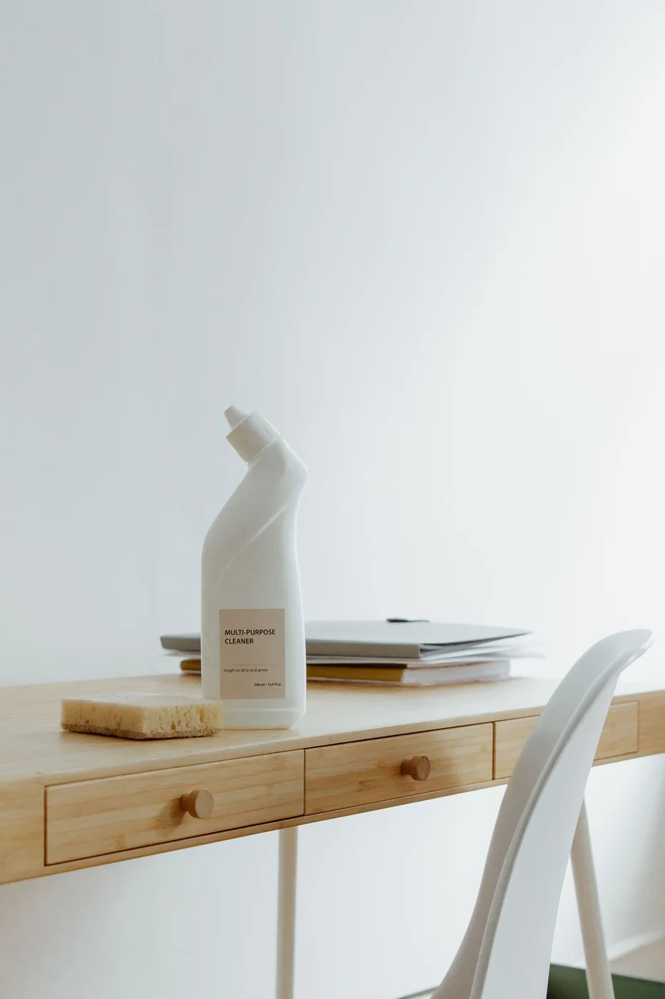 Cleaning products arranged on a workspace.