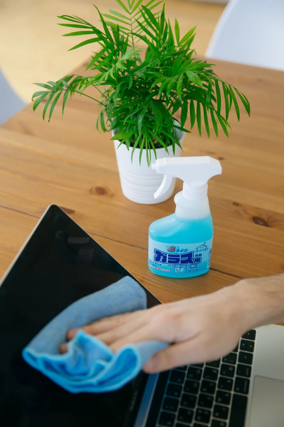 Hand cleaning a countertop.