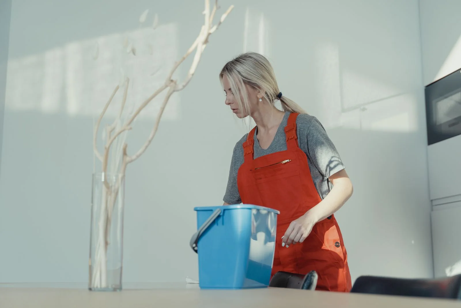 Cleaner mopping an office floor.