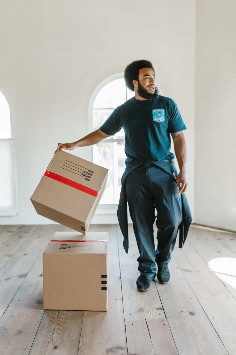 Resident moving boxes into a new home.
